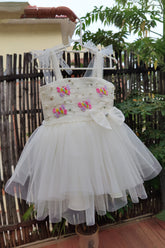 White draped dress with butterflies