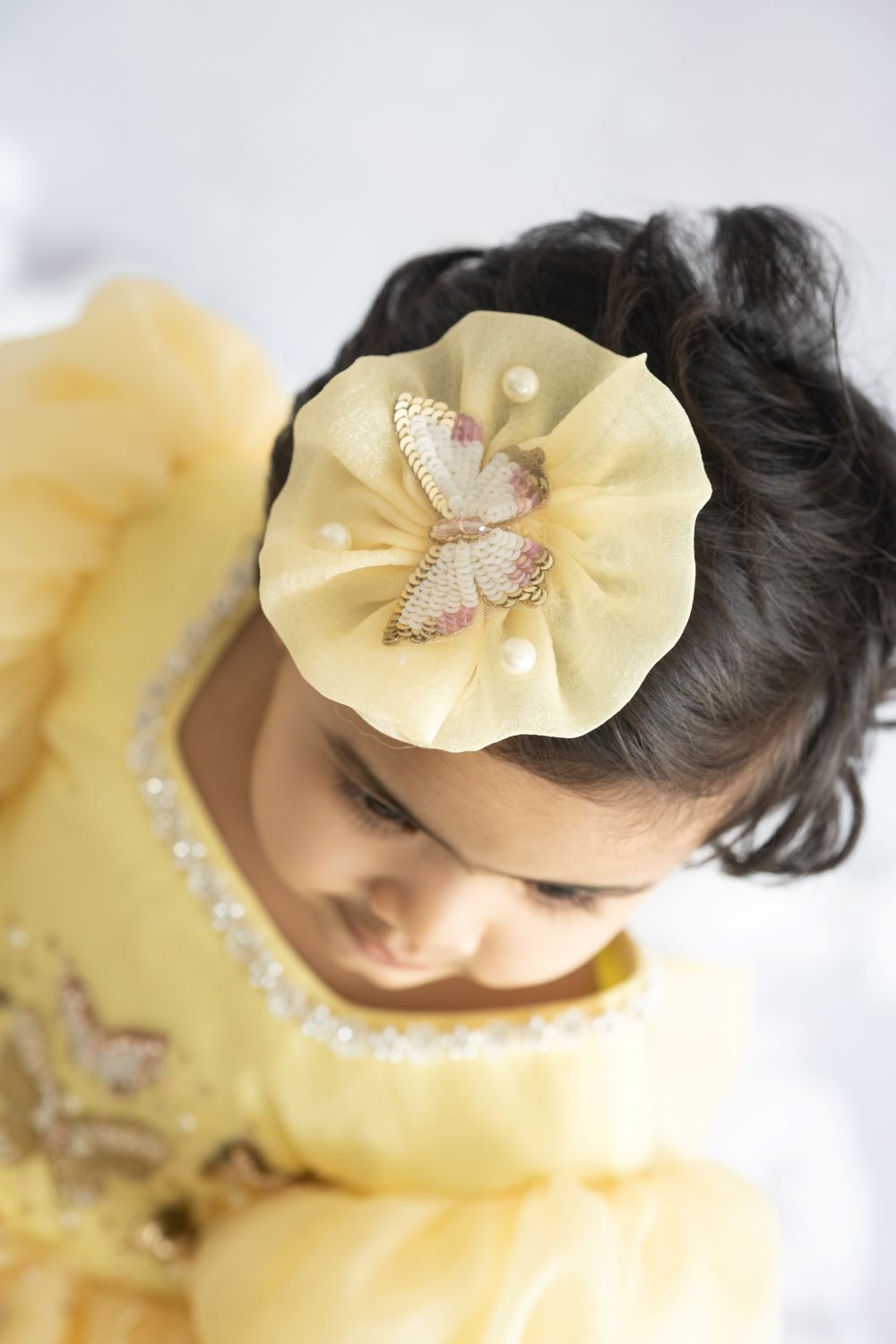 Yellow butterfly circular hair accessory